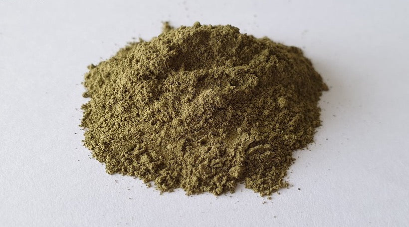 A loose mound of finely ground kratom powder